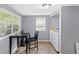 Convenient laundry room features a washer, dryer, folding table, and ample storage at 938 N Tuxedo St, Indianapolis, IN 46201