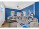 Spacious living room with a comfortable sectional sofa, cozy lighting, and a welcoming atmosphere at 938 N Tuxedo St, Indianapolis, IN 46201