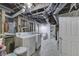 Unfinished basement with exposed plumbing, laundry area, and a view to a bathroom at 952 Lasalle St, Indianapolis, IN 46201