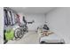 Sparse basement bedroom featuring a bed, clothing rack, and personal items at 952 Lasalle St, Indianapolis, IN 46201