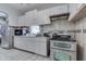 Kitchen featuring white cabinets, tile backsplash, and stainless steel appliances and a double oven at 952 Lasalle St, Indianapolis, IN 46201