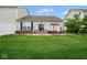 Inviting backyard with lush green lawn, patio area, and comfortable seating, perfect for outdoor relaxation at 9682 Angelica Dr, Noblesville, IN 46060