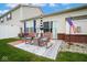 Relaxing backyard patio with comfortable seating and vibrant landscaping at 9682 Angelica Dr, Noblesville, IN 46060
