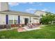 Serene backyard with patio, chairs, and lush lawn, perfect for outdoor enjoyment and entertaining at 9682 Angelica Dr, Noblesville, IN 46060
