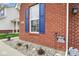 Attractive brick and siding home with blue shutters and a well-maintained gravel bed at 9682 Angelica Dr, Noblesville, IN 46060