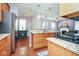 Kitchen with open layout, granite countertops, stainless steel appliances, and view to the living room and dining space at 9682 Angelica Dr, Noblesville, IN 46060