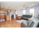 Spacious living area with hardwood floors, comfortable seating, and an open layout to the kitchen at 9682 Angelica Dr, Noblesville, IN 46060