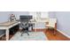 Bright home office with hardwood floors, and an office chair at 9682 Angelica Dr, Noblesville, IN 46060