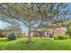 Lush backyard featuring a screened porch and inviting outdoor patio area at 9833 Parkshore Dr, Fishers, IN 46038