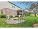 Landscaped backyard with a charming fire pit area for outdoor entertaining at 9833 Parkshore Dr, Fishers, IN 46038