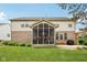 Well-maintained backyard featuring a screened porch and cozy outdoor seating at 9833 Parkshore Dr, Fishers, IN 46038
