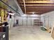 Unfinished basement with visible beams, concrete floor, and basic utilities at 9833 Parkshore Dr, Fishers, IN 46038