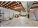 Unfinished basement featuring concrete walls, exposed ceiling, and stairway at 9833 Parkshore Dr, Fishers, IN 46038