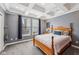 Bedroom features tray ceiling, gray walls, carpet, and two large windows at 9833 Parkshore Dr, Fishers, IN 46038