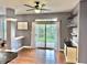 Dining room featuring a view to a screened in porch and a bar with wine storage at 9833 Parkshore Dr, Fishers, IN 46038