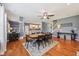The dining area features wood flooring and a view into the kitchen, great for entertaining at 9833 Parkshore Dr, Fishers, IN 46038