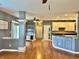 Open dining room and kitchen layout with hardwood floors and abundant natural light at 9833 Parkshore Dr, Fishers, IN 46038