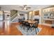 The dining area offers wood flooring, fireplace, and built-in shelving for cozy entertaining at 9833 Parkshore Dr, Fishers, IN 46038