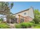 Charming home exterior showcasing a screened porch and pergola in the backyard at 9833 Parkshore Dr, Fishers, IN 46038