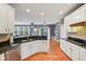 Bright kitchen boasts granite countertops, stainless steel appliances, and an open-concept layout at 9833 Parkshore Dr, Fishers, IN 46038