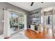 The living room connects with an outdoor area and features a custom cabinet with glassware storage at 9833 Parkshore Dr, Fishers, IN 46038