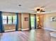 Spacious living room with hardwood floors, neutral walls, bright windows, and ceiling fan at 9833 Parkshore Dr, Fishers, IN 46038