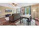 Comfortable living room featuring a large sectional, modern decor, and natural light from the windows at 9833 Parkshore Dr, Fishers, IN 46038