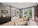 Light-filled living room with neutral color palette and access to the home's entry at 9833 Parkshore Dr, Fishers, IN 46038