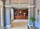 Open living room area featuring a built-in bookshelf and plenty of natural light at 9833 Parkshore Dr, Fishers, IN 46038