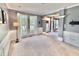 Living room featuring wainscotting, large windows, and great natural light at 9833 Parkshore Dr, Fishers, IN 46038