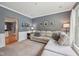 Relaxing living room features a neutral palette, wall decor and comfortable seating at 9833 Parkshore Dr, Fishers, IN 46038