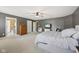 Main bedroom with a soft color scheme, large bed, and lots of natural light at 9833 Parkshore Dr, Fishers, IN 46038