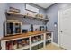 A walk-in pantry is outfitted with a custom-built countertop and open storage at 9833 Parkshore Dr, Fishers, IN 46038