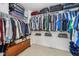 Walk-in closet with clothing racks, upper shelving, and a storage trunk at 9833 Parkshore Dr, Fishers, IN 46038