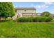 Manicured lawn and landscaping in the backyard, perfect for outdoor enjoyment at 101 Meadowview Dr, Mooresville, IN 46158