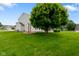 Lush backyard with well-maintained lawn and mature trees at 101 Meadowview Dr, Mooresville, IN 46158