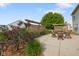 Relaxing backyard patio area surrounded by beautiful landscaping and lush greenery at 101 Meadowview Dr, Mooresville, IN 46158