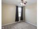 Bedroom features a ceiling fan, window with curtains, neutral paint and carpet at 101 Meadowview Dr, Mooresville, IN 46158