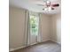 Bedroom features a window with light-colored curtains, ceiling fan, carpet and neutral paint at 101 Meadowview Dr, Mooresville, IN 46158