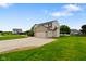 Shot of a two-story home with an attached garage, long driveway, and a well-manicured front yard at 101 Meadowview Dr, Mooresville, IN 46158