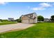 Attractive home showcasing a long driveway, two-car garage, and a well-manicured lawn in a serene setting at 101 Meadowview Dr, Mooresville, IN 46158