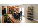 Open concept living room with tile floors and black shelving unit at 101 Meadowview Dr, Mooresville, IN 46158