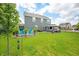 Lush backyard showcasing a seating area, patio furniture, a well-maintained lawn, and mature trees adding beauty at 1026 Woodglen Dr, Westfield, IN 46074