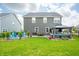 Expansive backyard with a well-manicured lawn, a gazebo, patio furniture, and privacy landscaping creating a tranquil retreat at 1026 Woodglen Dr, Westfield, IN 46074
