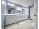 Spacious primary bathroom with double sinks, a large window, modern fixtures, and a tile floor at 1026 Woodglen Dr, Westfield, IN 46074