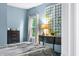 Well-lit bedroom featuring a full bed, a black dresser, and a decorative wall lattice with climbing vines at 1026 Woodglen Dr, Westfield, IN 46074