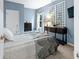 Cozy bedroom featuring a full bed, a black dresser, and a decorative wall lattice with climbing vines at 1026 Woodglen Dr, Westfield, IN 46074