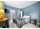 Comfortable bedroom with large bed, side table, and ensuite bathroom including open door to shower at 1026 Woodglen Dr, Westfield, IN 46074