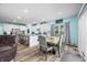 Dining area with wood-look floors and natural light that's open to the kitchen and living spaces at 1026 Woodglen Dr, Westfield, IN 46074