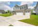 Attractive two-story home boasts a covered front porch, stone accents, and well-manicured landscaping at 1026 Woodglen Dr, Westfield, IN 46074